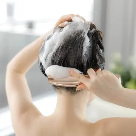 The Brashu Revo Multifunctional comb for washing the scalp, massage and styling