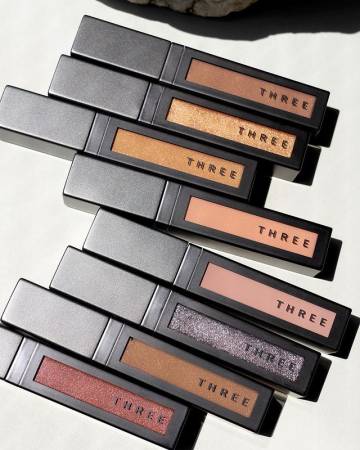 THREE United Fluid Eye Color Liquid eye shadow with pearly shine